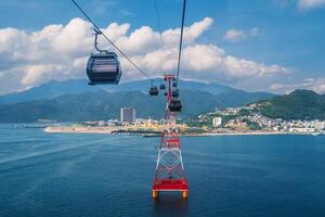 ropeway of cableway over sea to Hon Tre Island at Vinpearl Amusement Park in Nha Trang in Vietnam photo
