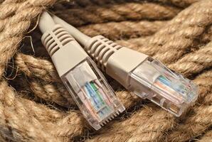 Patch cord of network cable on rope skein closeup internet conception photo