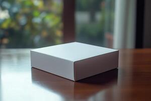 White box on table with blurred background photo