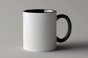 A white and black coffee mug on a gray background photo