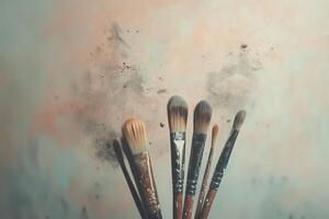 Collection of paintbrushes resting against neutral background with canvas for creative artistic expression photo