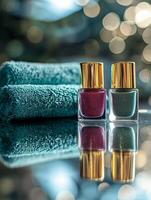 Nail polish bottles reflecting softly on a towel with blurred background bokeh effect photo