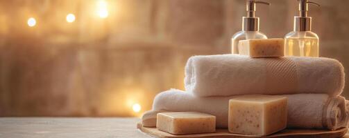 Clean and serene bath setup with soap bars, rolled towels, and dispenser bottles in a softly lit environment photo