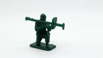 6. Plastic soldier toy holding weapon isolated photo