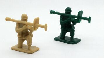 29. Plastic soldier toy holding weapon on white background photo
