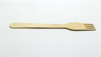 2. Wooden spoon and fork on white background photo