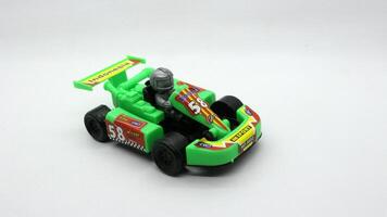 6. F1 car toy isolated on white background photo