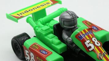 5. F1 car toy isolated on white background photo