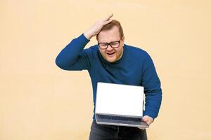 A perplexed Caucasian man furrowing brows over laptop, conjuring digital dilemmas, World Backup Day musings, pixelated conundrums, bewilderment aura photo