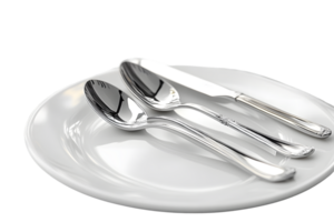 Elegant Silverware Set on White Plate A Modern Dining Table Arrangement with Shiny Cutlery and png
