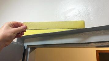 Hand measuring door height with ruler, showcasing home improvement, renovation projects, precise carpentry, and DIY craftsmanship skills photo