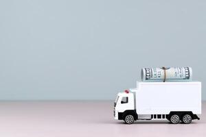 White toy truck with boxes on the blue background, space for text. photo