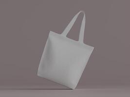 A white tote bag suspended with a slight lean, placed against a muted mauve-gray background. photo