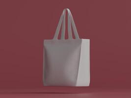 A white tote bag with long handles, centered and standing upright, in front of a deep red-maroon background. photo