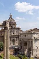 Exploring ancient ruins and majestic architecture in the heart of Rome on a sunny afternoon photo