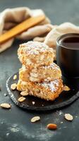 A delicious stack of almond cookies displayed on a white plate perfect for sharing or enjoying with tea photo