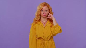 Redhead girl in dress pointing at camera, showing stupid gesture blaming some idiot for insane plan video