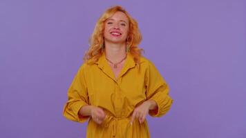 Overjoyed redhead girl showing rock n roll gesture by hands, cool sign shouting yeah with crazy face video