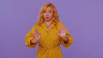 Girl on purple studio background pointing fingers himself ask say who me no thanks I do not need it video