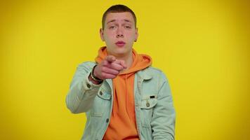 Handsome adult man pointing to camera and looking with playful happy expression, making choice video