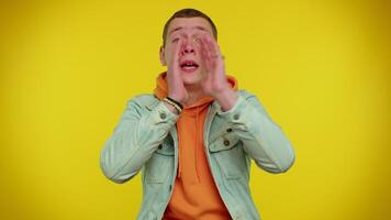 Man scream with hand near mouth waving and greeting with hand as notices someone shouting hello video