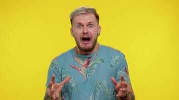 Scared fearful depressed man expresses his fear and waves his hands away from danger, waving no video