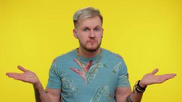Confused handsome man feeling embarrassed about ambiguous question, having doubts, no idea, clueless video