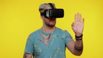Man using virtual reality futuristic technology VR headset helmet to play simulation 3D game video