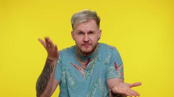 Tourist man pointing at camera and showing stupid gesture blaming some idiot for insane plan video