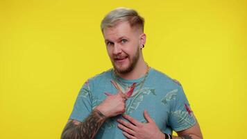 Handsome adult man pointing to camera and looking with playful happy expression, making choice video