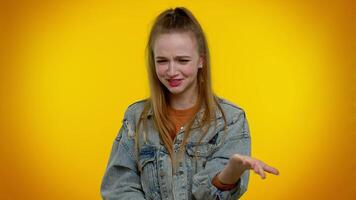 Upset girl cries, raising hands in indignant expression asking why what reason of failure irritation video