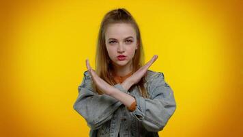 Girl say no hold palm folded crossed hands in stop gesture, warning of finish, prohibited access video