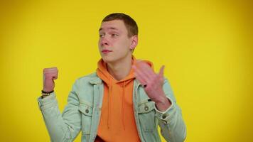 Teen stylish man showing inviting gesture with hands, ask to join, beckoning to coming, welcome video