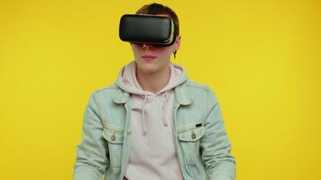 Man using virtual reality futuristic technology VR headset helmet to play simulation 3D game video