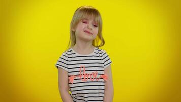 Smiling happy kid child girl blinking eye, looking at camera with toothy smile, winking, flirting video