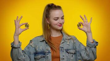 Teenager girl showing golden bitcoins, career, cryptocurrency investment, mining, future technology video