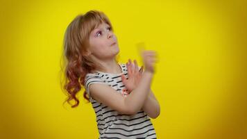 Sneaky playful blonde child girl conspiring scheming, thinking over tricky plan, cunning expression video