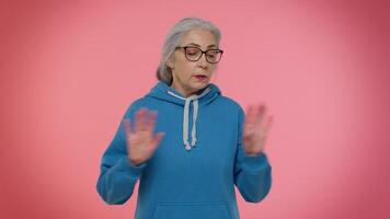 Confused senior old granny woman pointing fingers himself ask say who me no thanks i do not need it video