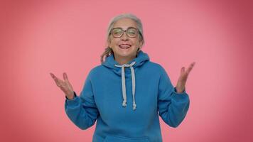 Happy joyful senior old granny woman laughing out loud after hearing ridiculous anecdote, funny joke video