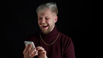 Shocked happy smiling winning of man while browsing on smartphone, feeling happiness, fun, enjoyment video