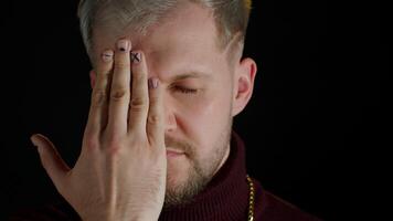 Confident stylish bearded man in sensually looking at camera with one eye, posing, facial expression video