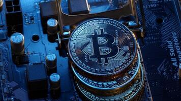 Bitcoin BTC coins in CPU central processor socket on digital pc motherboard, mining crypto currency video