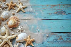 Seashells with starfish and beach sand on wooden background photo
