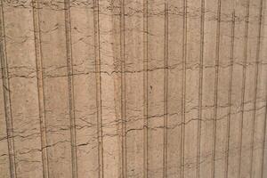 Patterns of cracked earth highlight drought conditions in an agricultural field during late summer photo