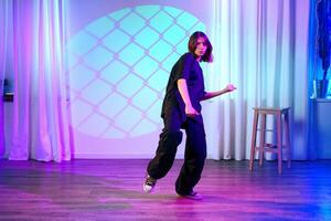 Dance performance in a colorful studio with unique lighting, showcasing expressive movements and creative style photo