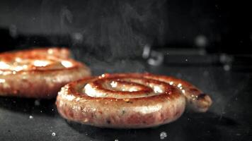 Sausages are grilled. Filmed on a high-speed camera at 1000 fps. High quality FullHD footage video