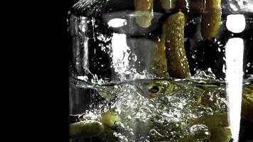Pickled cucumbers in a jar. Filmed on a high-speed camera at 1000 fps. High quality FullHD footage video
