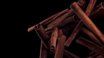 Cinnamon sticks fly up and down. Filmed on a high-speed camera at 1000 fps. High quality FullHD footage video