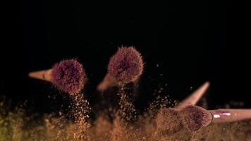 Makeup brushes fly up and down. Filmed on a high-speed camera at 1000 fps. High quality FullHD footage video