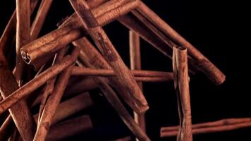 Cinnamon sticks fly up and down. Filmed on a high-speed camera at 1000 fps. High quality FullHD footage video